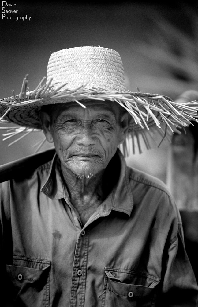Black and white photo of an old Cambodian man