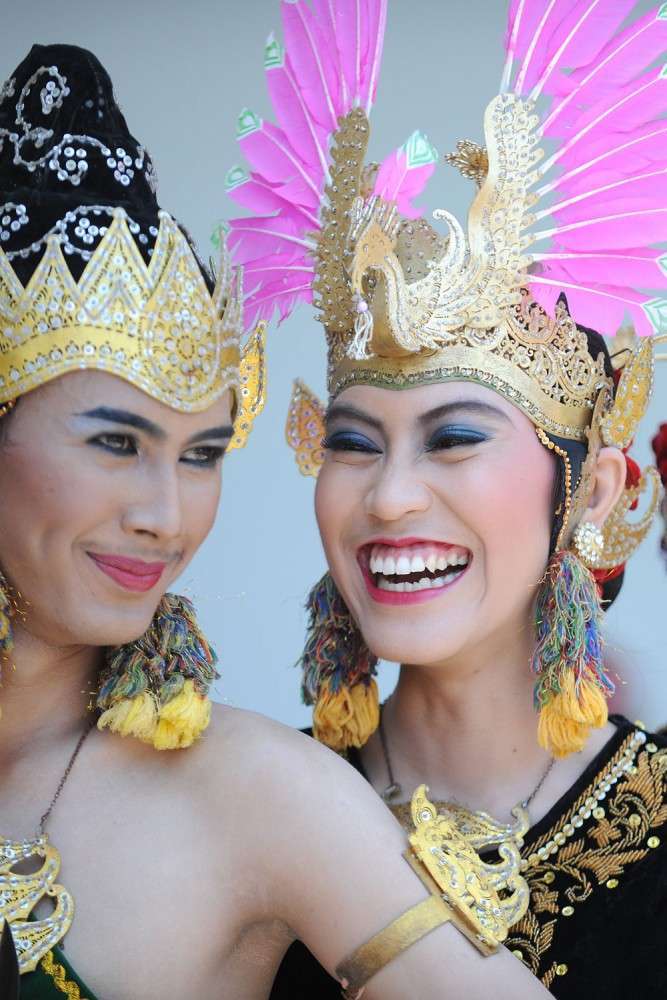Traditional Dancers caught in a playful moment that the Sultan's Palace, Yogyakarta