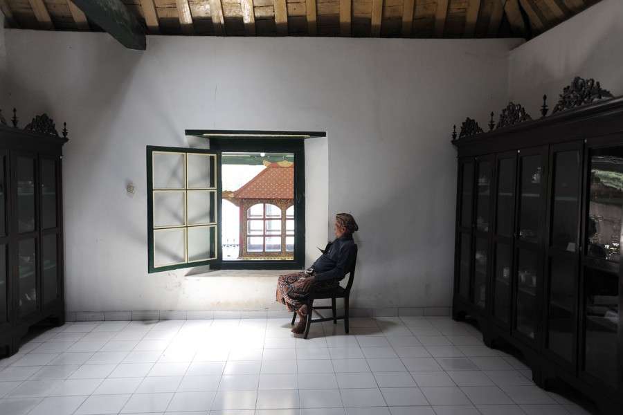 A guard snoozes at the Sultan's Palace, Yogyakarta, Indonesia.